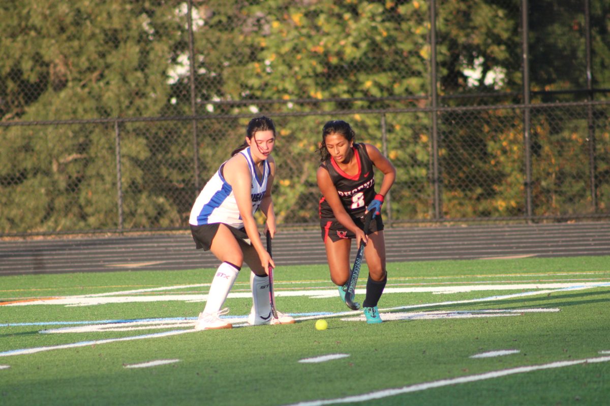 Freshman Nandita Shaju attempts to dribble around a Tuscarora.