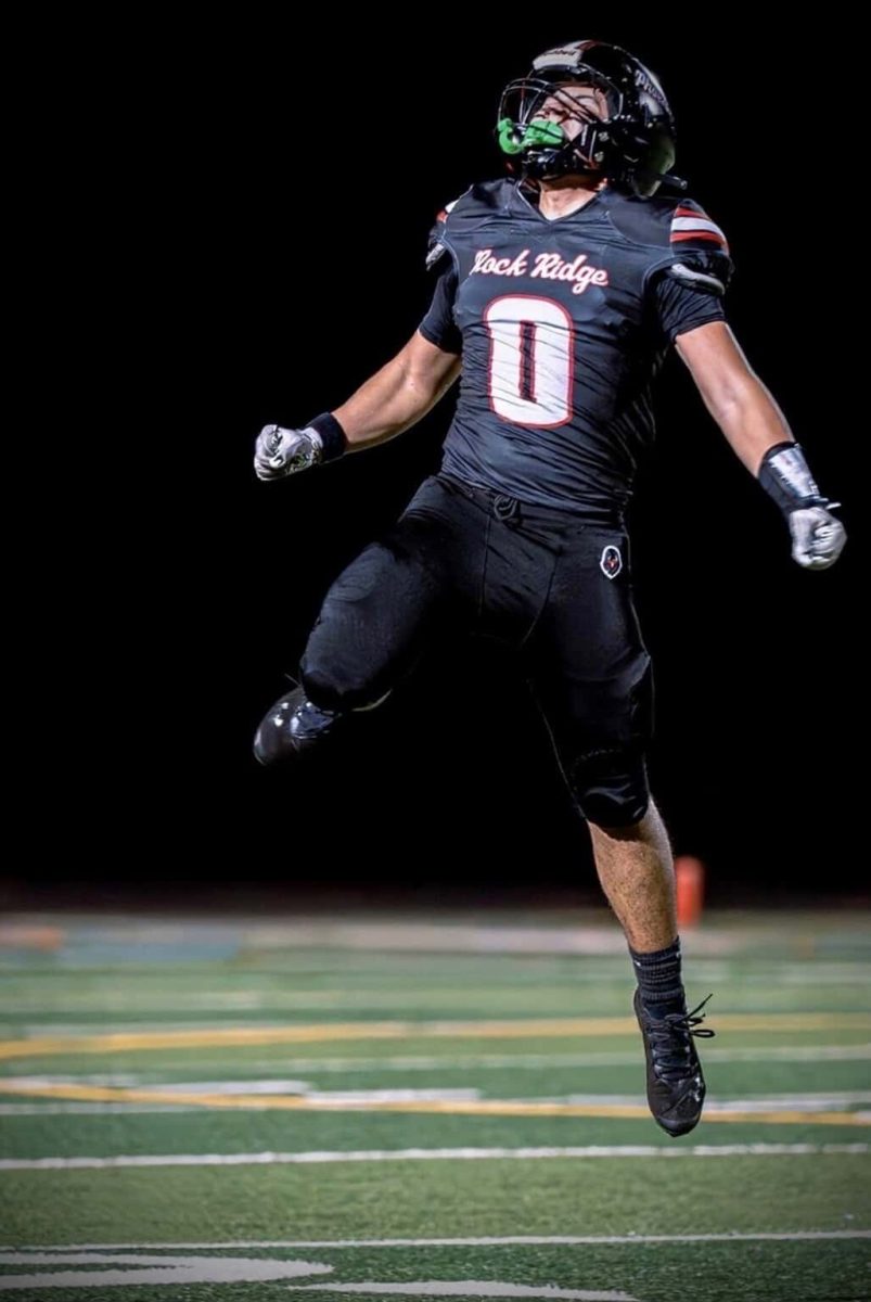 Senior Paxton So jumps in the air after a good play. 