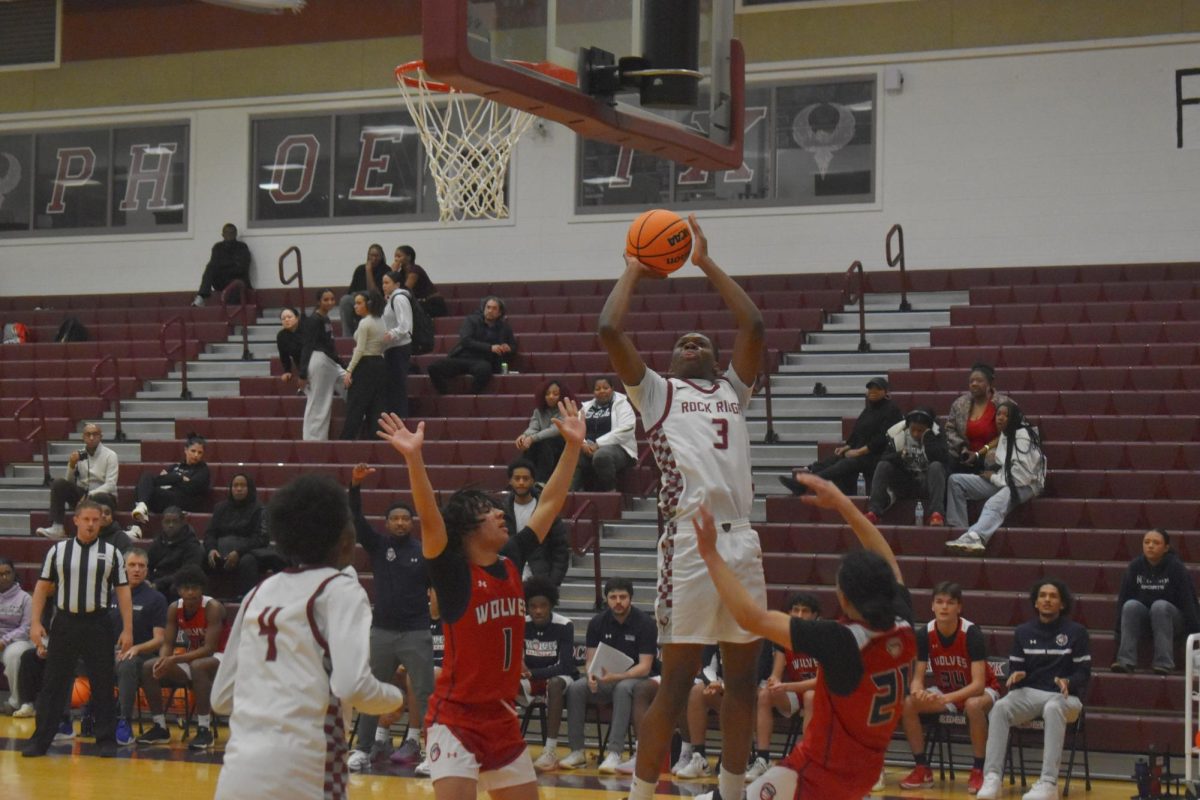  Sophomore small forward Shawn Makassi goes up for a layup against the Wolves.