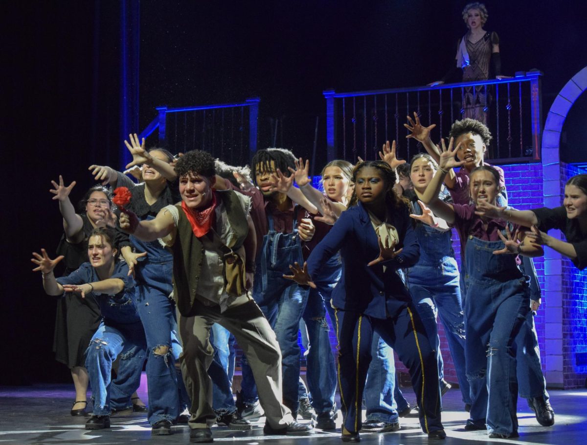 Orpheus (senior Andrés Marrero) and Hermes (senior Marian Lindsay) sing and dance to “Wait For Me.” “Orpheus has a lot more connection to the environment around him,” Marrero said. “He's very connected to everybody in the story.”