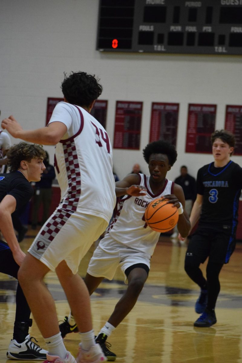 Senior shooting guard Dylan Chemoiwa drives towards the basket.