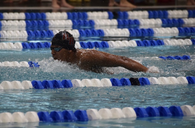 Freshman Ayan Chethan performs butterfly stroke.