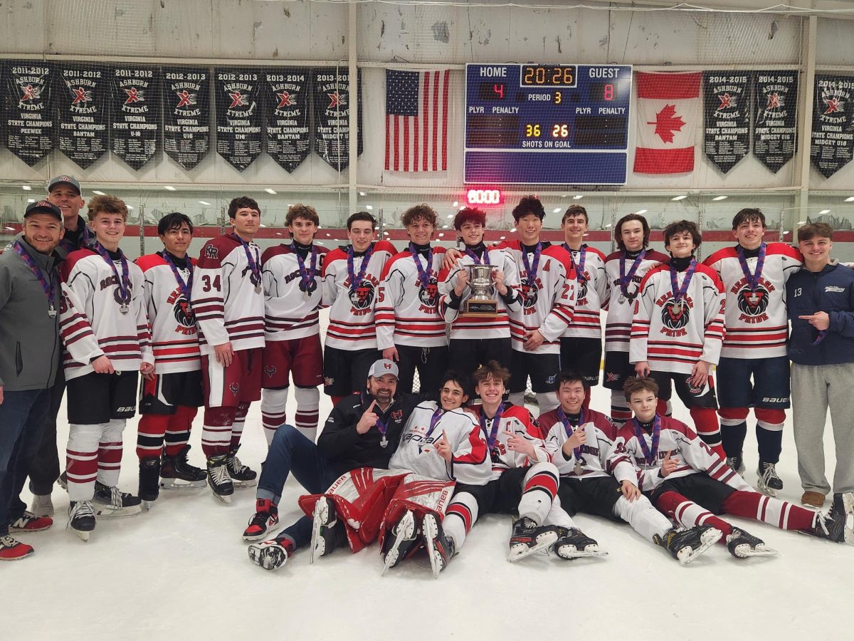 HRR boys' hockey team gathers together for a group photo. “We were all on the bench, excited. I couldn't wait for the game to end to see the medals,” Freshmen Forward Noah Wilkins said. Photo courtesy of Bhavitha Doma.