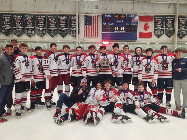 HRR boys' hockey team gathers together for a group photo. “We were all on the bench, excited. I couldn't wait for the game to end to see the medals,” Freshmen Forward Noah Wilkins said. Photo courtesy of Bhavitha Doma.