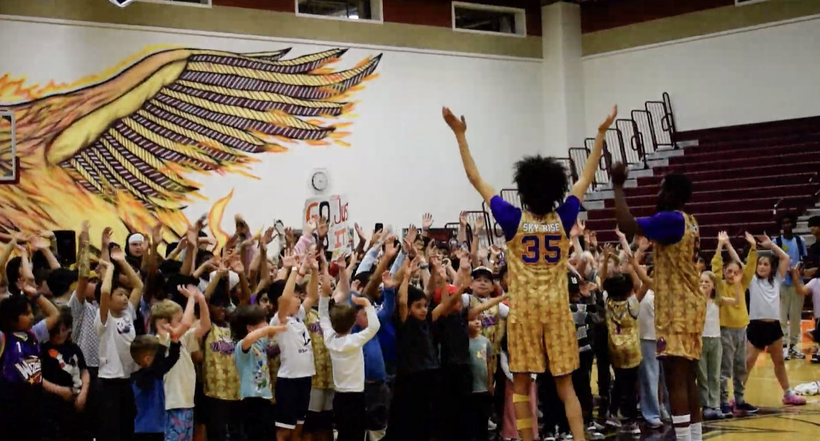 Surrounded by excited students, Harlem Wizards players turn the game into an interactive experience, filling the gym with laughter, energy, and spirit.