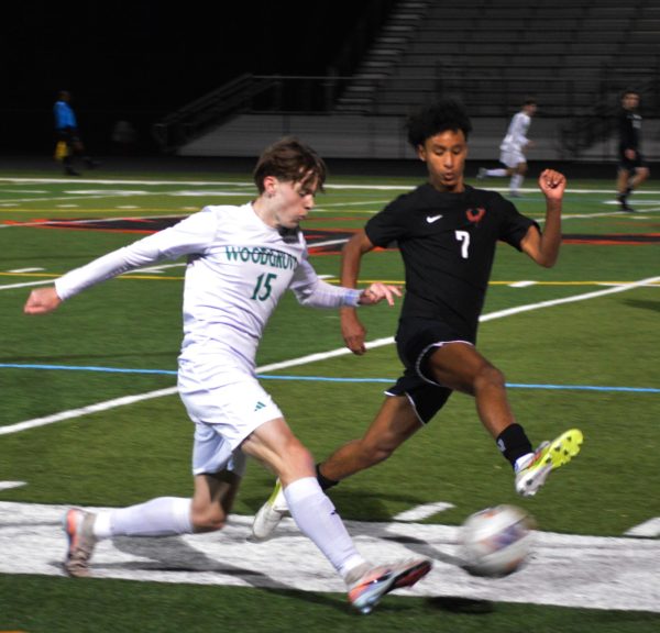 Sophomore Victor Stewert kicks the ball into the offensive zone. 