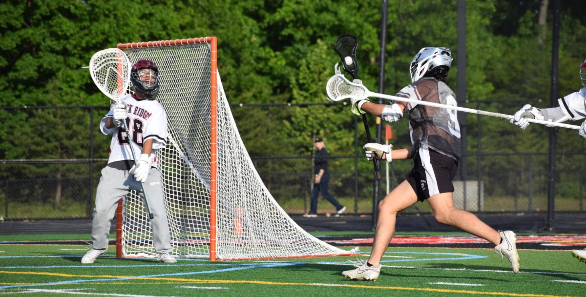 Senior David Cheong attempts to stop the Dominion Titans from scoring a goal.