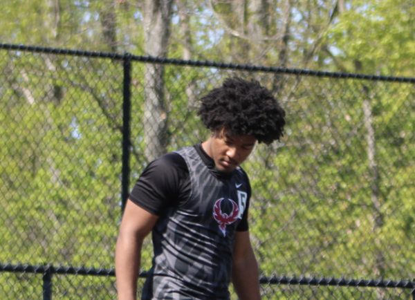 Senior Xavier Smith steadies himself before running a relay race.