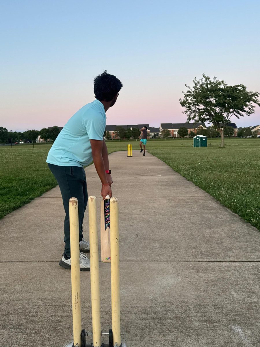 Cricket club member prepares to bat the bowler’s delivery. Photo courtesy of Sair Sheikh.